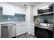 Updated kitchen with stainless steel appliances and white shaker cabinets at 2700 Ocean Shore Blvd # 317, Ormond Beach, FL 32176