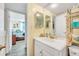 Clean bathroom with white vanity and tiled shower at 2800 N Atlantic Ave # 212, Daytona Beach, FL 32118