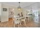 White table and chairs in bright dining area with mirrored wall at 2800 N Atlantic Ave # 212, Daytona Beach, FL 32118