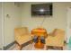 Game room with chairs and small table for games at 2800 N Atlantic Ave # 212, Daytona Beach, FL 32118