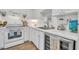 Bright white kitchen features modern appliances and wood-look floors at 2800 N Atlantic Ave # 212, Daytona Beach, FL 32118