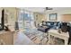Relaxing living room with blue sectional sofa and ocean view at 2800 N Atlantic Ave # 212, Daytona Beach, FL 32118