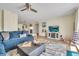 Comfortable living room with blue sectional sofa and ocean view at 2800 N Atlantic Ave # 212, Daytona Beach, FL 32118