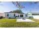 Updated home with firepit and grassy backyard at 3263 S Peninsula Dr, Daytona Beach, FL 32118