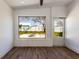 Gathering room with view of backyard and firepit at 3263 S Peninsula Dr, Daytona Beach, FL 32118