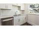 Modern kitchen with white cabinets and quartz countertops at 3263 S Peninsula Dr, Daytona Beach, FL 32118