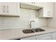 Modern kitchen with white shaker cabinets and stainless steel appliances at 3263 S Peninsula Dr, Daytona Beach, FL 32118