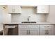 Modern kitchen with white shaker cabinets and stainless steel appliances at 3263 S Peninsula Dr, Daytona Beach, FL 32118