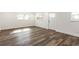 Spacious living area featuring vinyl plank flooring and natural light at 3263 S Peninsula Dr, Daytona Beach, FL 32118