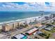 Oceanfront building aerial view, showing beach, road, and nearby businesses at 3501 S Atlantic Ave # 2030, Daytona Beach, FL 32118