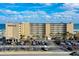 Aerial view of Pirates Cove Resort, showing building and parking lot at 3501 S Atlantic Ave # 2030, Daytona Beach, FL 32118