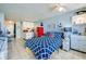 Nautically-themed bedroom with a queen bed and kitchenette at 3501 S Atlantic Ave # 2030, Daytona Beach, FL 32118