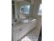 Bathroom boasts double vanity and tiled floor at 525 E Roberts St, Orange City, FL 32763