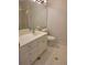 Clean bathroom with single vanity and tiled floors at 525 E Roberts St, Orange City, FL 32763