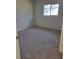 Spacious bedroom with neutral carpeting and large window at 525 E Roberts St, Orange City, FL 32763