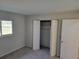 Bedroom with closet and window, neutral decor at 525 E Roberts St, Orange City, FL 32763