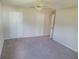 Bedroom with ceiling fan and double door closet at 525 E Roberts St, Orange City, FL 32763
