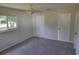 Bright bedroom with window, closet, and ceiling fan at 525 E Roberts St, Orange City, FL 32763