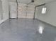 Garage with washer and dryer, and open door at 525 E Roberts St, Orange City, FL 32763