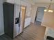 Modern kitchen with white cabinets, stainless steel appliances, and gray countertops at 525 E Roberts St, Orange City, FL 32763
