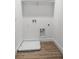 Laundry room with tile floor and built-in shelving at 553 Coronado Cove Rd, New Smyrna Beach, FL 32168