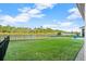 Expansive grassy backyard with a lake view at 588 Mosaic Blvd, Daytona Beach, FL 32124
