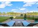 Spacious backyard oasis with a patio overlooking a lake at 588 Mosaic Blvd, Daytona Beach, FL 32124