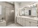 Double vanity bathroom with modern finishes and a large mirror at 588 Mosaic Blvd, Daytona Beach, FL 32124