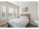 Cozy bedroom with a full-size bed and plenty of natural light at 588 Mosaic Blvd, Daytona Beach, FL 32124