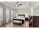 Bright bedroom with a king-size bed, large windows, and ample closet space at 588 Mosaic Blvd, Daytona Beach, FL 32124