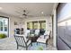 Covered patio with seating area and outdoor fireplace at 588 Mosaic Blvd, Daytona Beach, FL 32124