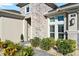 Inviting home exterior with stone accents and landscaping at 588 Mosaic Blvd, Daytona Beach, FL 32124