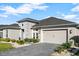 Elegant home with stone accents and a well-manicured lawn at 588 Mosaic Blvd, Daytona Beach, FL 32124