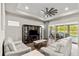 Relaxing living room with large windows and patio access at 588 Mosaic Blvd, Daytona Beach, FL 32124