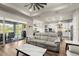 Open living room showcasing a spacious layout, modern furniture, and access to a relaxing patio at 588 Mosaic Blvd, Daytona Beach, FL 32124