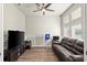 Home office with wood floors, large TV, and comfortable couch at 588 Mosaic Blvd, Daytona Beach, FL 32124