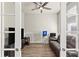 Home office with wood floors, large TV, and comfortable couch at 588 Mosaic Blvd, Daytona Beach, FL 32124
