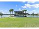 Quaint gazebo overlooking a lake with lush landscaping at 628 Mosaic Blvd, Daytona Beach, FL 32124