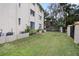 Small backyard with grass and a wooden fence at 633 S Palmetto Ave # 1010, Daytona Beach, FL 32114