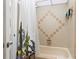Updated bathroom with a shower/tub and decorative shower curtain at 633 S Palmetto Ave # 1010, Daytona Beach, FL 32114