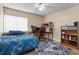 Bedroom with blue bedspread and built-in shelving at 633 S Palmetto Ave # 1010, Daytona Beach, FL 32114