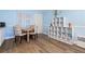 Small dining area with table and shelving unit at 633 S Palmetto Ave # 1010, Daytona Beach, FL 32114