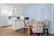 Bright kitchen with white cabinets and wood floors at 633 S Palmetto Ave # 1010, Daytona Beach, FL 32114