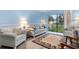Living room features two armchairs, sofa and sliding glass doors at 633 S Palmetto Ave # 1010, Daytona Beach, FL 32114