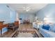 Open living area with light blue walls and wood-look floors at 633 S Palmetto Ave # 1010, Daytona Beach, FL 32114