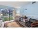 Living area with view to backyard, featuring a sofa and armchairs at 633 S Palmetto Ave # 1010, Daytona Beach, FL 32114