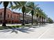 Street view showing palm trees and buildings at 633 S Palmetto Ave # 1010, Daytona Beach, FL 32114