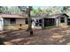 Backyard view of house with screened porch at 690 N Sparkman Ave, Orange City, FL 32763