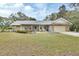 One-story home with stone accents and a spacious lawn at 955 N Ridgewood Ave, Deland, FL 32720