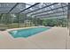 Inviting screened-in pool with ample deck space at 955 N Ridgewood Ave, Deland, FL 32720
